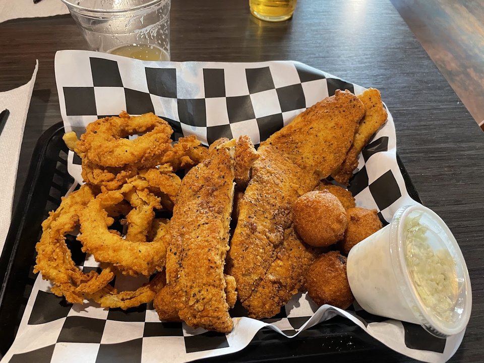 Golden fried seafood served with simple sides.